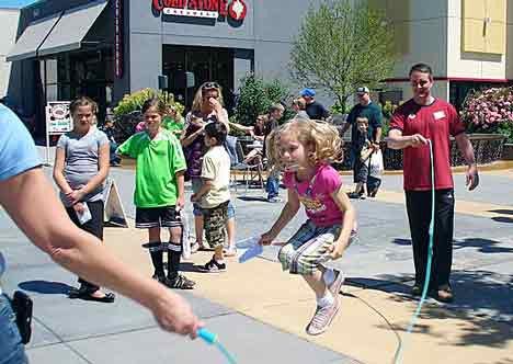 A youngster shows her jump-roping finesse June 12 during the Cruzin' Passport Summer Challenge kickoff event at Kent Station. The free 'Fit Day' event included interactive booths