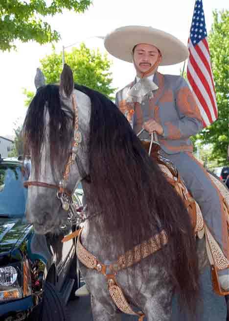 A horseman evokes images of Mexico with his authentic caballero dress and well-appointed horse; during a past Cornucopia Grand Parade.