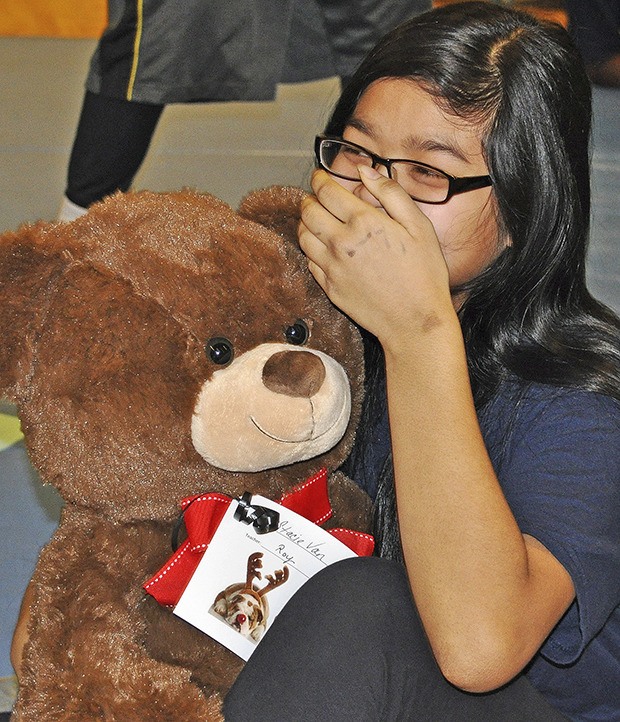 Mill Creek Middle School seventh-grader Stacie Van is overcome with emotion upon receiving a large stuffed teddy bear last Friday.