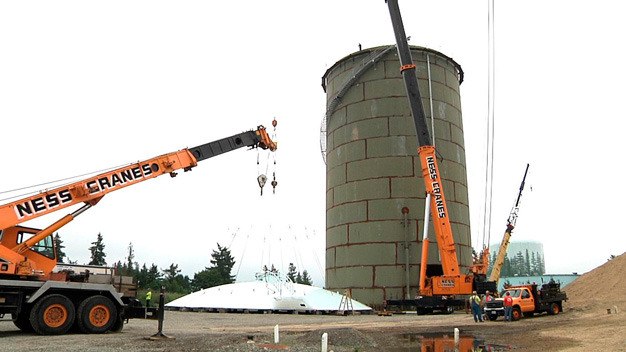 Crews cap off a new water tower Wednesday on Kent's East Hill at Southeast 248th Street and 124th Avenue Southeast