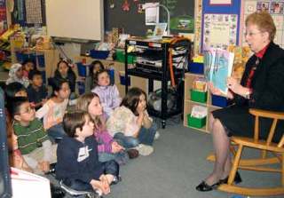 Students in Mrs. Waterman’s second-grade class at Neely-O’Brien Elementary listen as Superintendent Barbara Grohe reads to them during Read Across America Day Feb. 27.