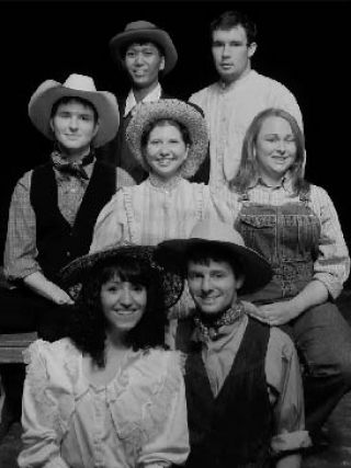The cast of Icon Theatre’s upcoming production of “Oklahoma!” gathers round for a photo. Pictured above