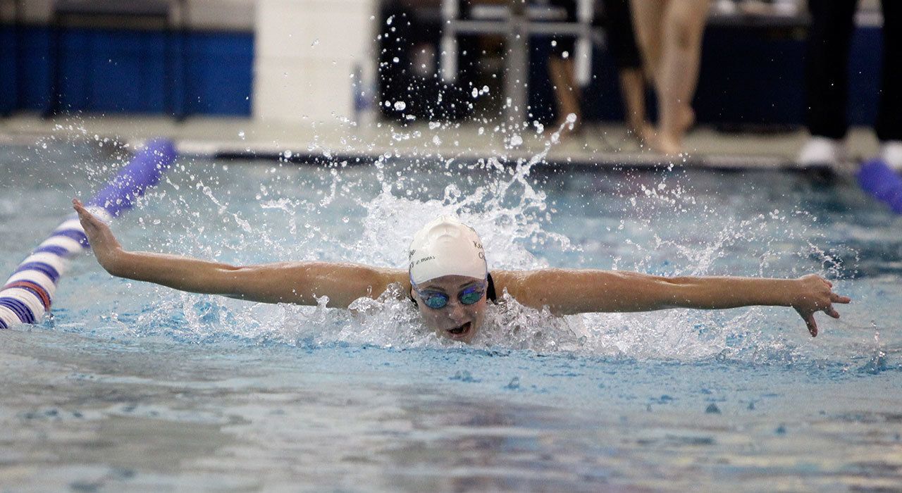Kentridge High School’s Haley Childress, who was named to the first team all-league for the 4A North Puget Sound League, swims to a first-place finish the 100-yard butterfly at the 4A West Central District championship meet on Oct. 29. COURTESY PHOTO, Tracy Arnold
