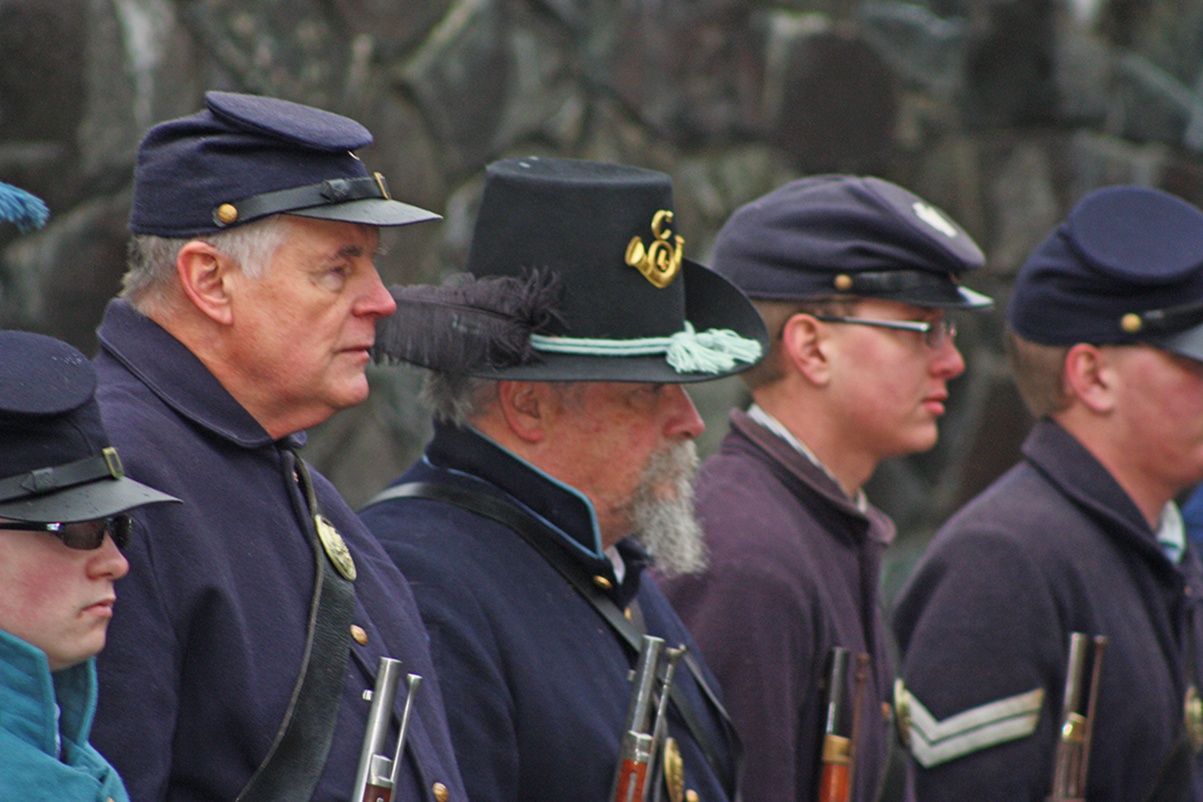 Civil War re-enactors stand at attention at the ceremony. MARK KLAAS, Kent Reporter