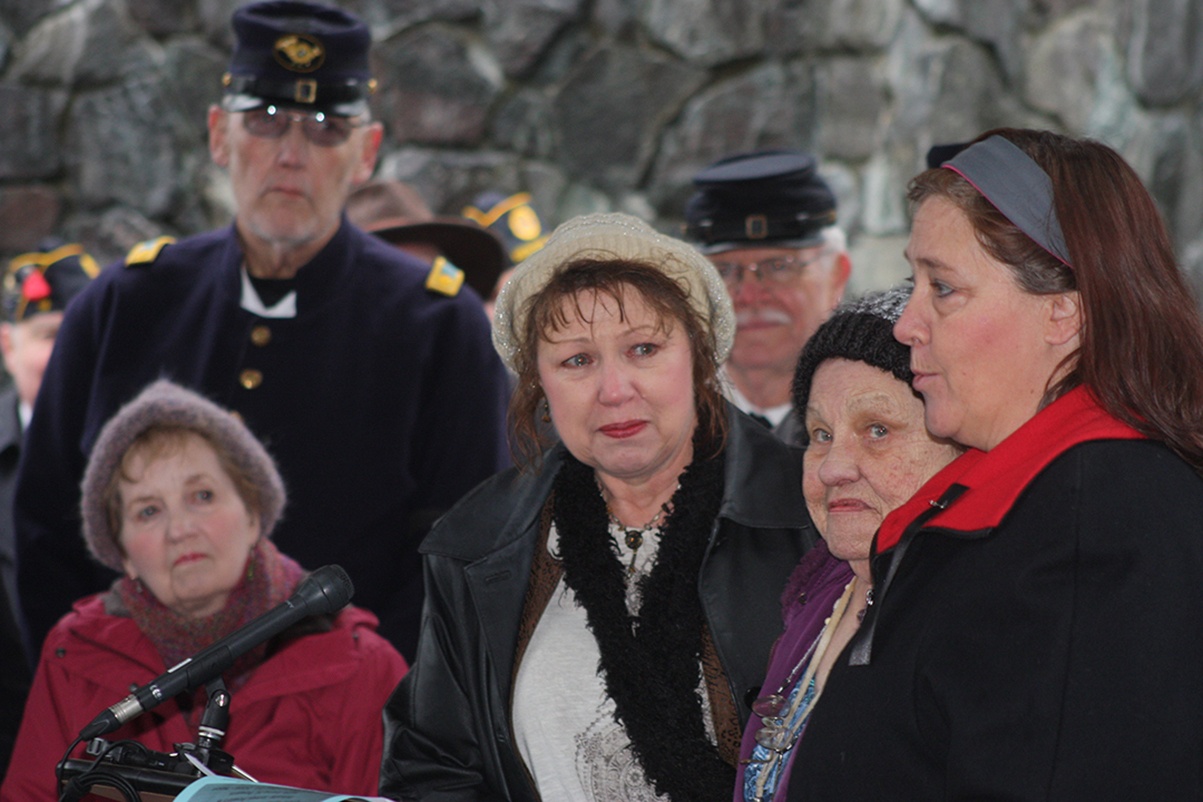 Descendants of Civil War veteran James Powers speak at the ceremony. They included, Glenna Miller, second from the left, Lorraine Burnett, third from the left, and Jill Mohler.