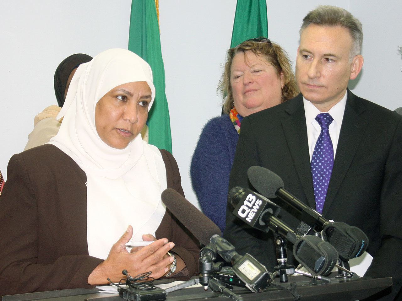 Risho Sapano, executive director of the Mother Africa resource center in Kent, speaks at a Dec. 15 press conference as King County Executive Dow Constantine looks on during an annoucement about funding for 27 nonprofit groups as part of the Best Starts for Kids levy.