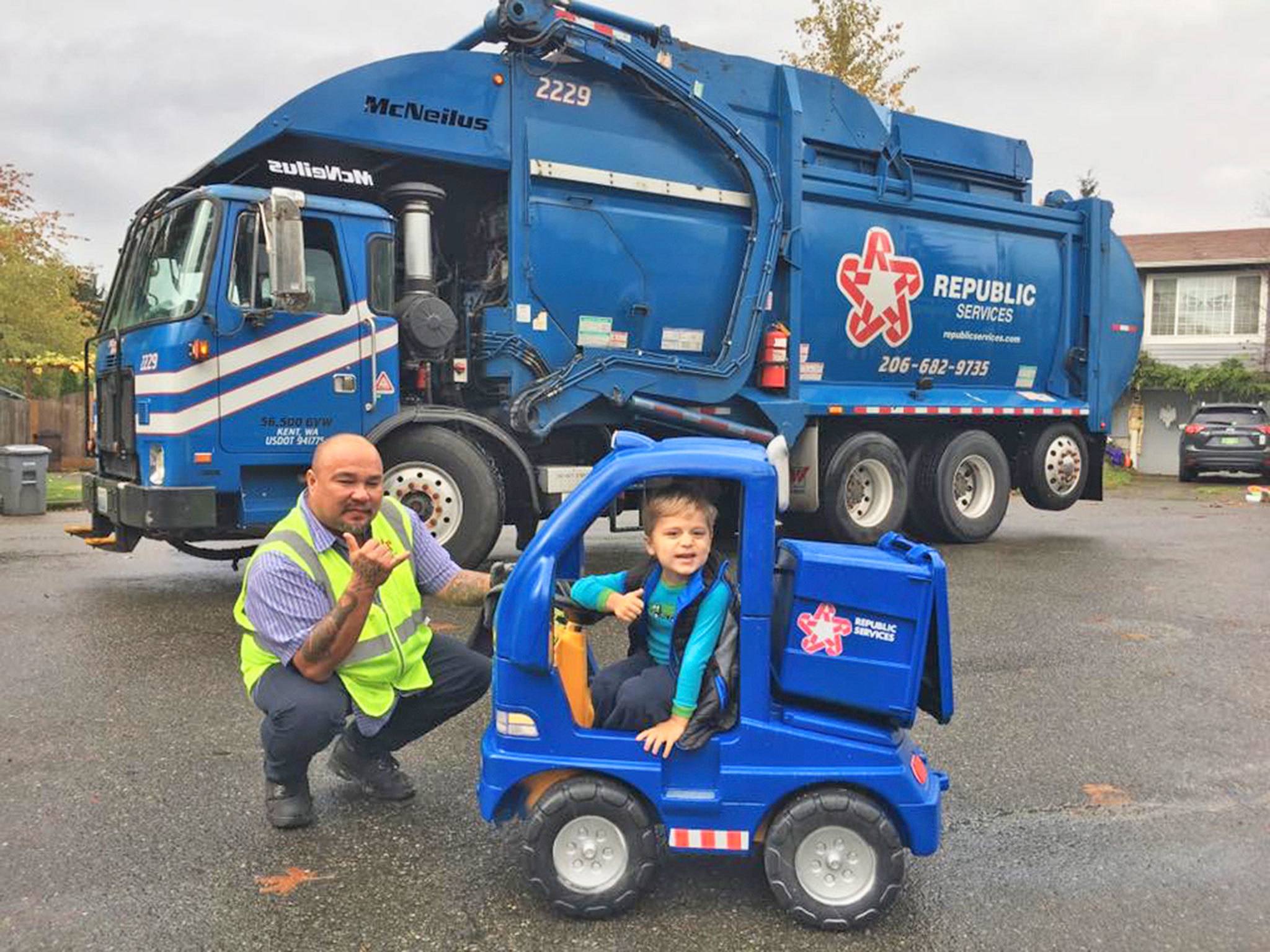 Republic Services’ residential recycling collection driver Robert McKee and a little boy named Max. COURTESY PHOTO