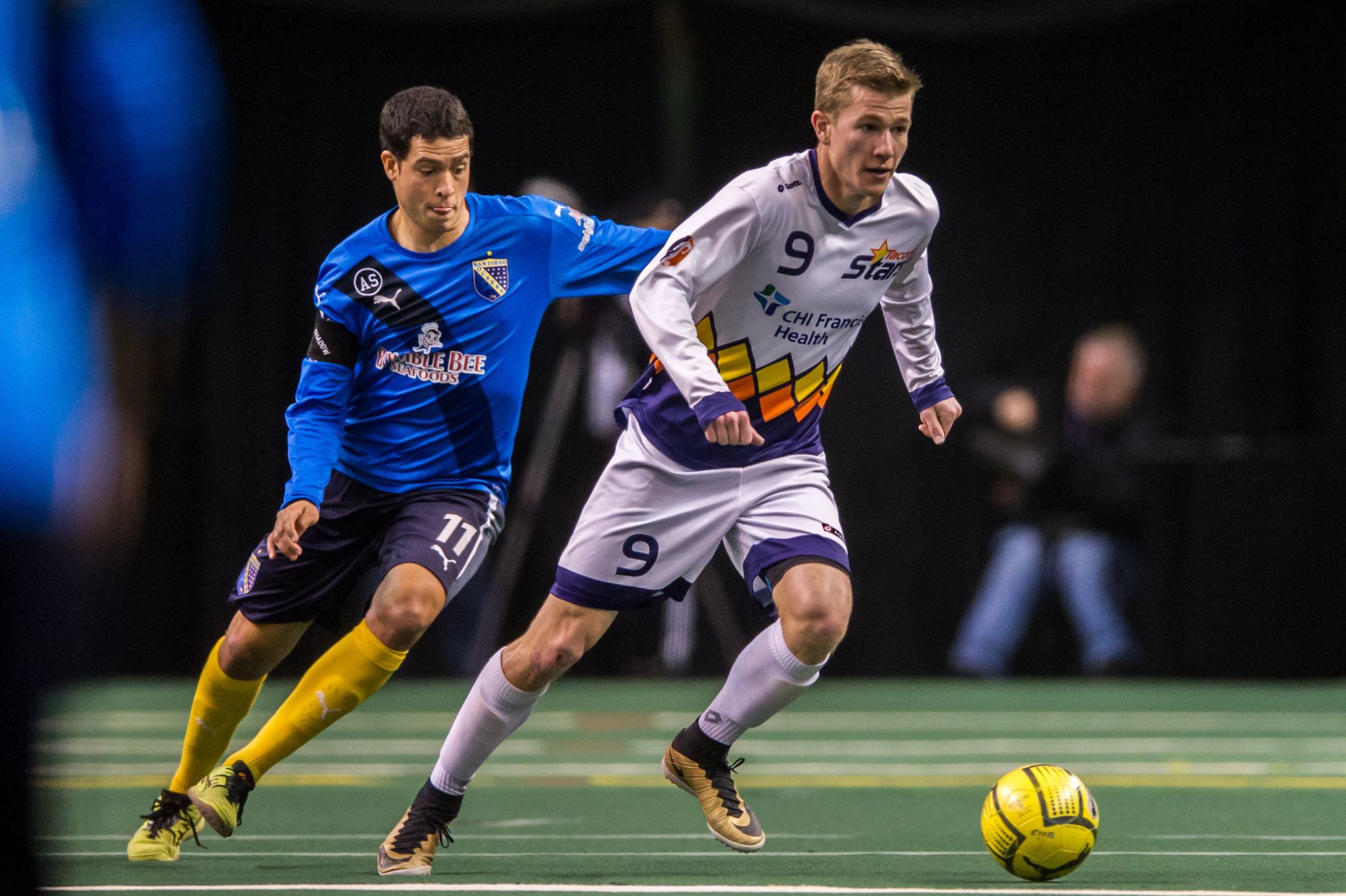 The Stars’ Derek Johnson brings the ball upfield with the Shockers’ Luan Oliveira in pursuit during a match last year in Kent. COURTESY PHOTO, Wilson Tsoi, Tacoma Stars