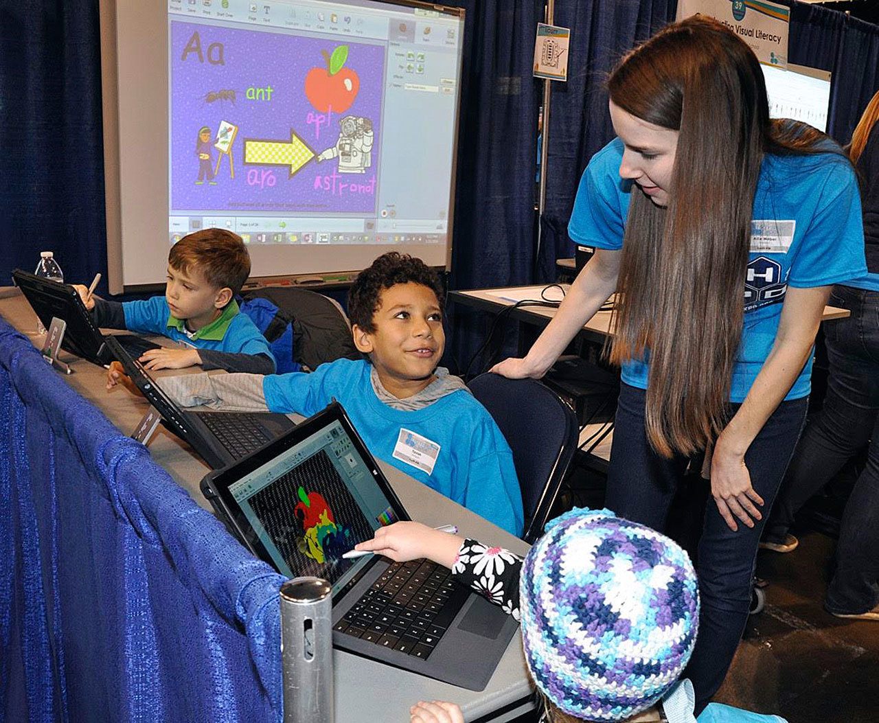 Teacher Allie Weber helps students use computers during last year’s Tech Expo at the ShoWare Center. The event returns to the venue next Thursday, Jan. 19. HEIDI SANDERS, Kent Reporter