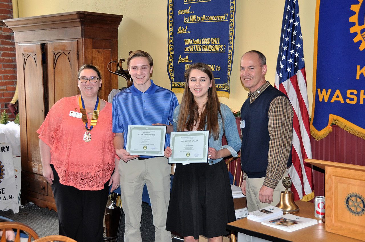 Joining Kentwood High School students Matthew Barden and Rachel Canning at the presentation are Kent Rotary President Amy Hobson and Greg Haffner, public relations chair of the Rotary Club. COURTESY PHOTO