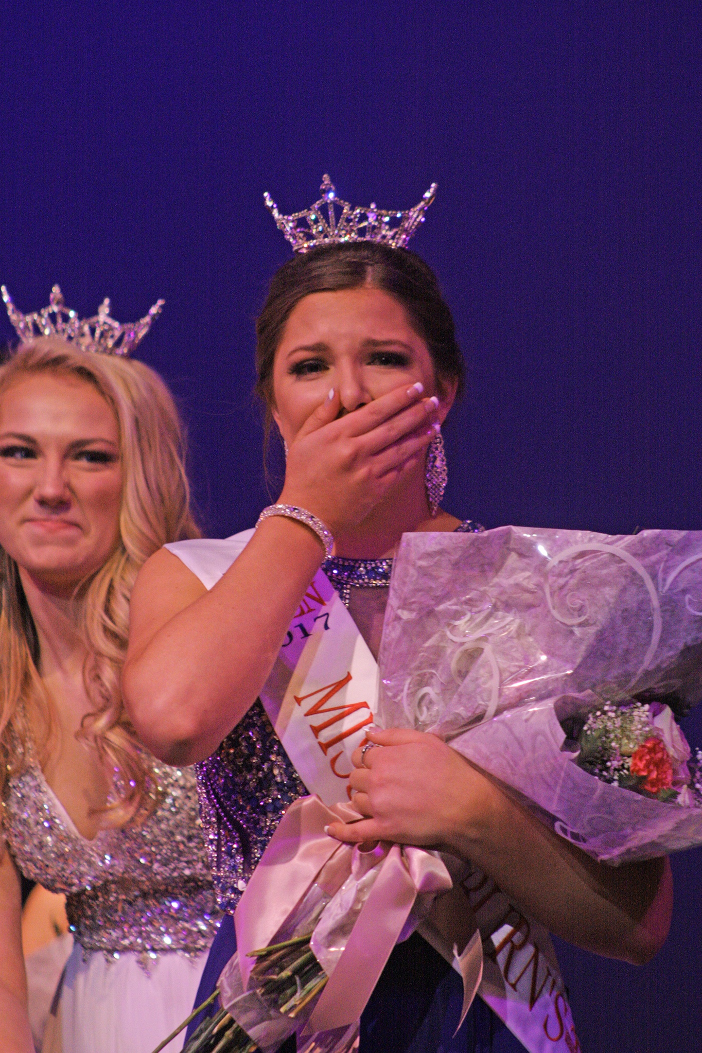 An emotional Elizabeth Enz, right, receives the crown from Jaclyn Seifert, 2016 Miss Auburn’s Outstanding Teen. MARK KLAAS, Reporter