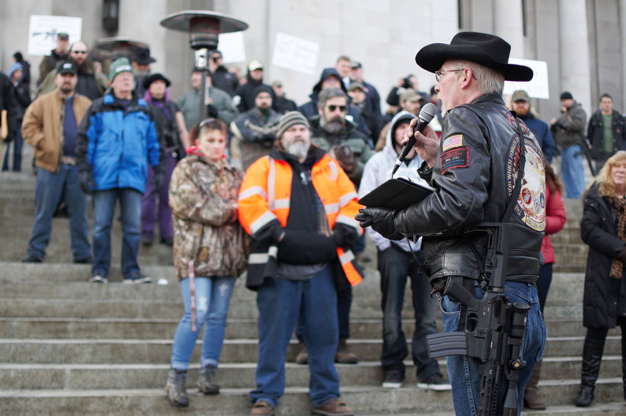 Rick Halle, national coordinator of the Gun Rights Coalition, addresses attendees to the Rally 4 UR Rights rally at the Washington State Capitol on Jan. 13. “Gun rights is a non-partisan issue,” Halle said, urging supporters to remember the second amendment is an American right, not just a conservative or Republican right. Various bills have been introduced to the Legislature regarding gun rights and control, including a bill that would require gun dealers to offer to sell or give a lock or lock box with every gun sale. COURTESY PHOTO, Enrique Pérez de la Rosa, WNPA Olympia News Bureau