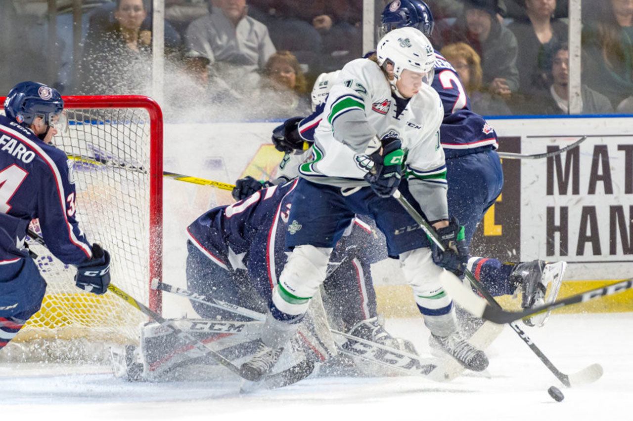 The Thunderbirds’ Ryan Gropp tries to handle the puck in front of the Americans’ goal during WHL play Sunday night at the ShoWare Center. COURTESY PHOTO, Brian Liesse/T-Birds