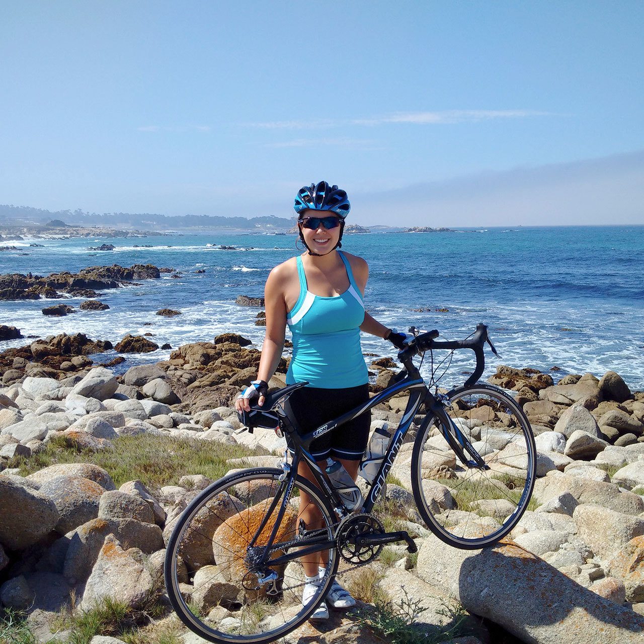 Kent’s Jaclyn Rainey takes in the rocky central California coast during a pause in her long-distance ride to Mexico last summer. COURTESY PHOTO