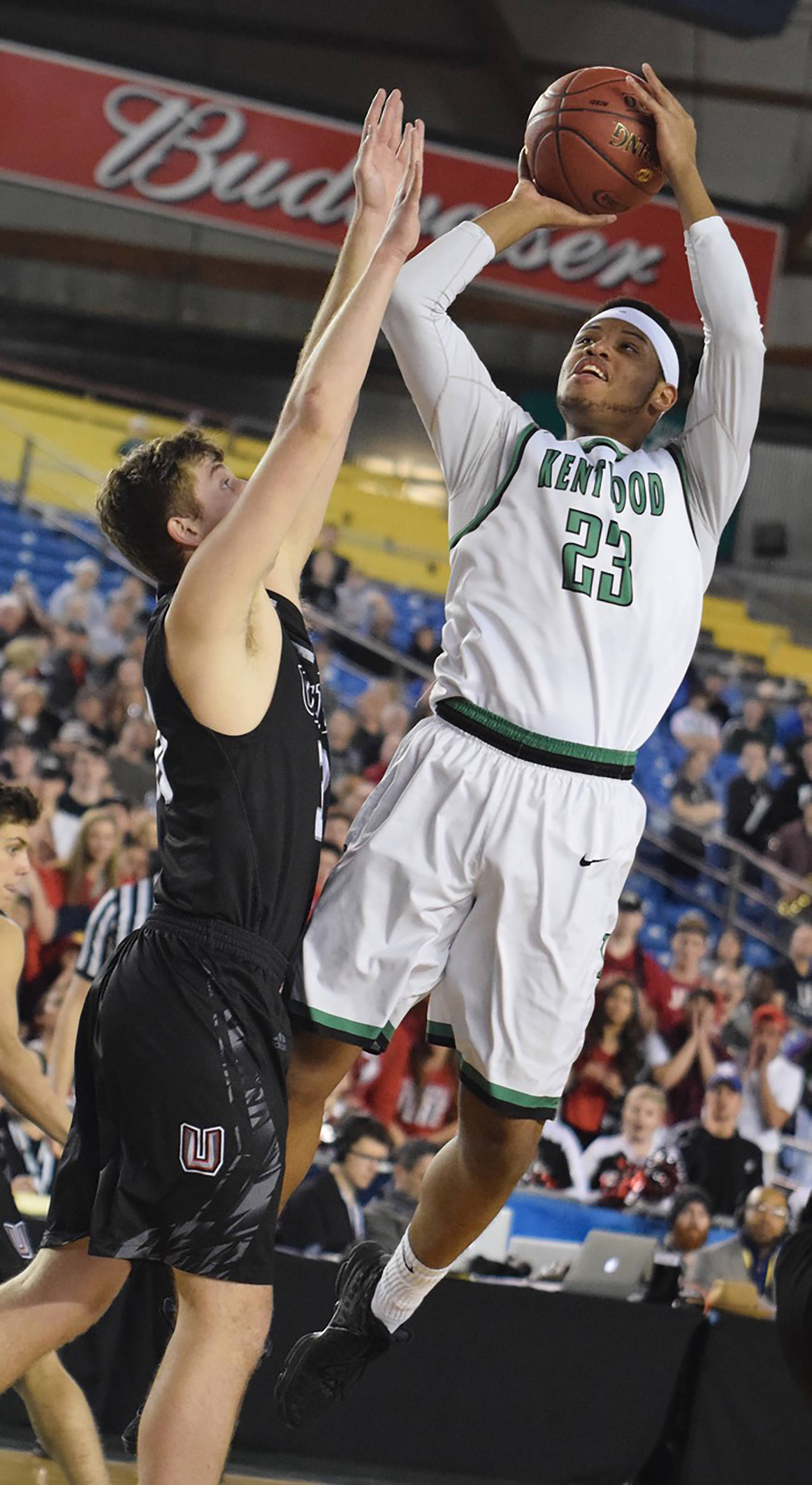 Kentwood’s Eli’sha Sheppard soars to shoot over the Union defense during the 4A championship game at the Tacoma Dome on Saturday. RACHEL CIAMPI, Reporter