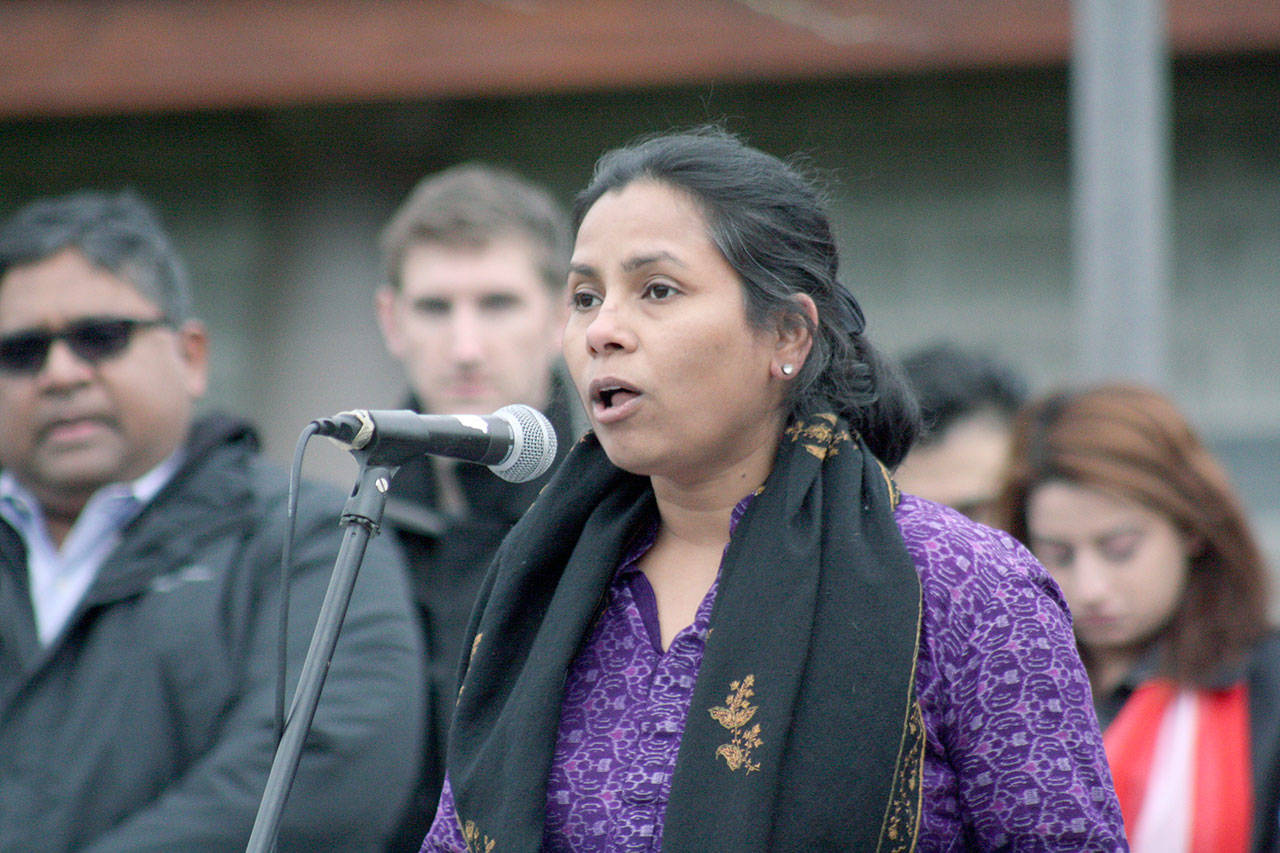 Rita Meher, a Sammamish resident and vigil organizer, speaks at the rally in Bellevue on Sunday. Reporter photo, Ryan Murray