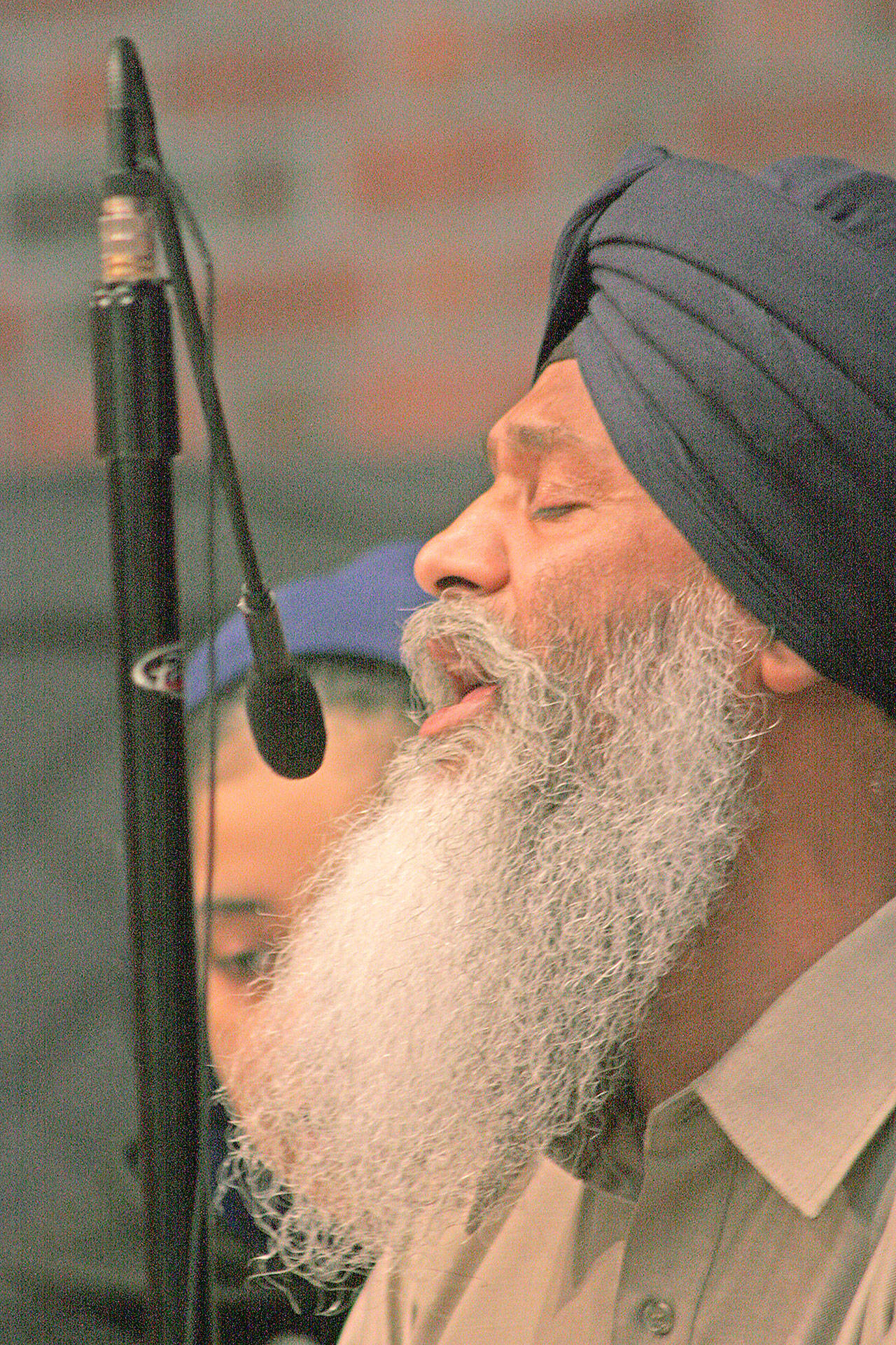 Bhai Mann Singh performs a ceremonial song during the community rally at Kent Lutheran Church on Saturday. MARK KLAAS, Kent Reporter