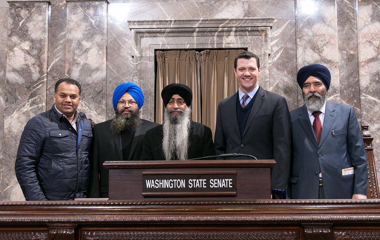 Sen. Joe Fain, with Sikh leaders, in the Senate chambers on Tuesday. COURTESY PHOTO
