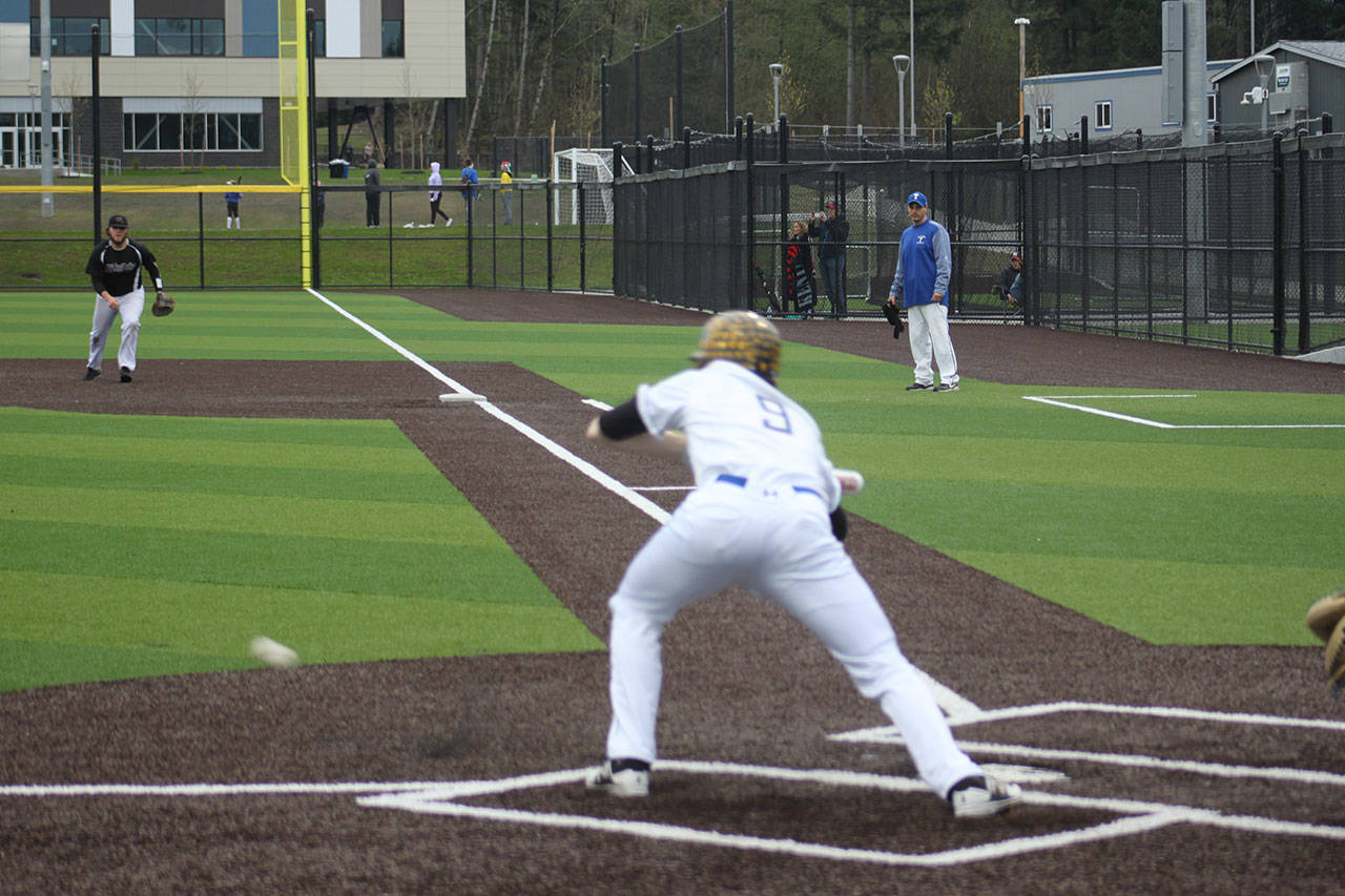 Tahoma senior Connor Kiffer lays down a bunt Wednesday along the third baseline.