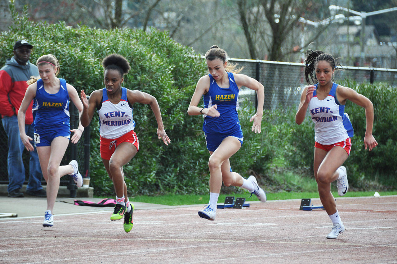 Kent-Meridian High’s Olivia Carter, far right, takes off in the 100-meter run during a meet against Hazen High on March 30. Carter took second place in the race with at time of 12.99 seconds. HEIDI SANDERS, Kent Reporter
