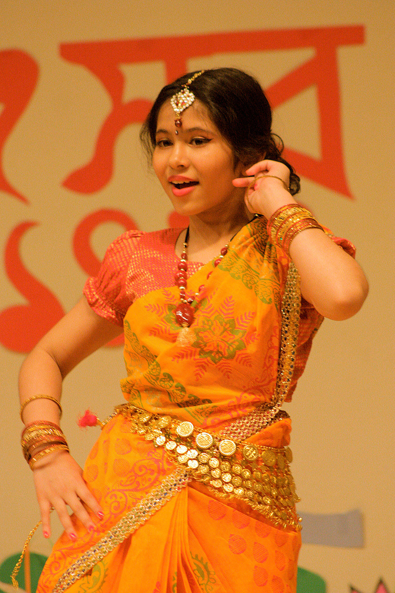 Rijah Taher, 11, performs a dance during a Bengali New Year celebration last Saturday at the Kent Senior Activity Center.