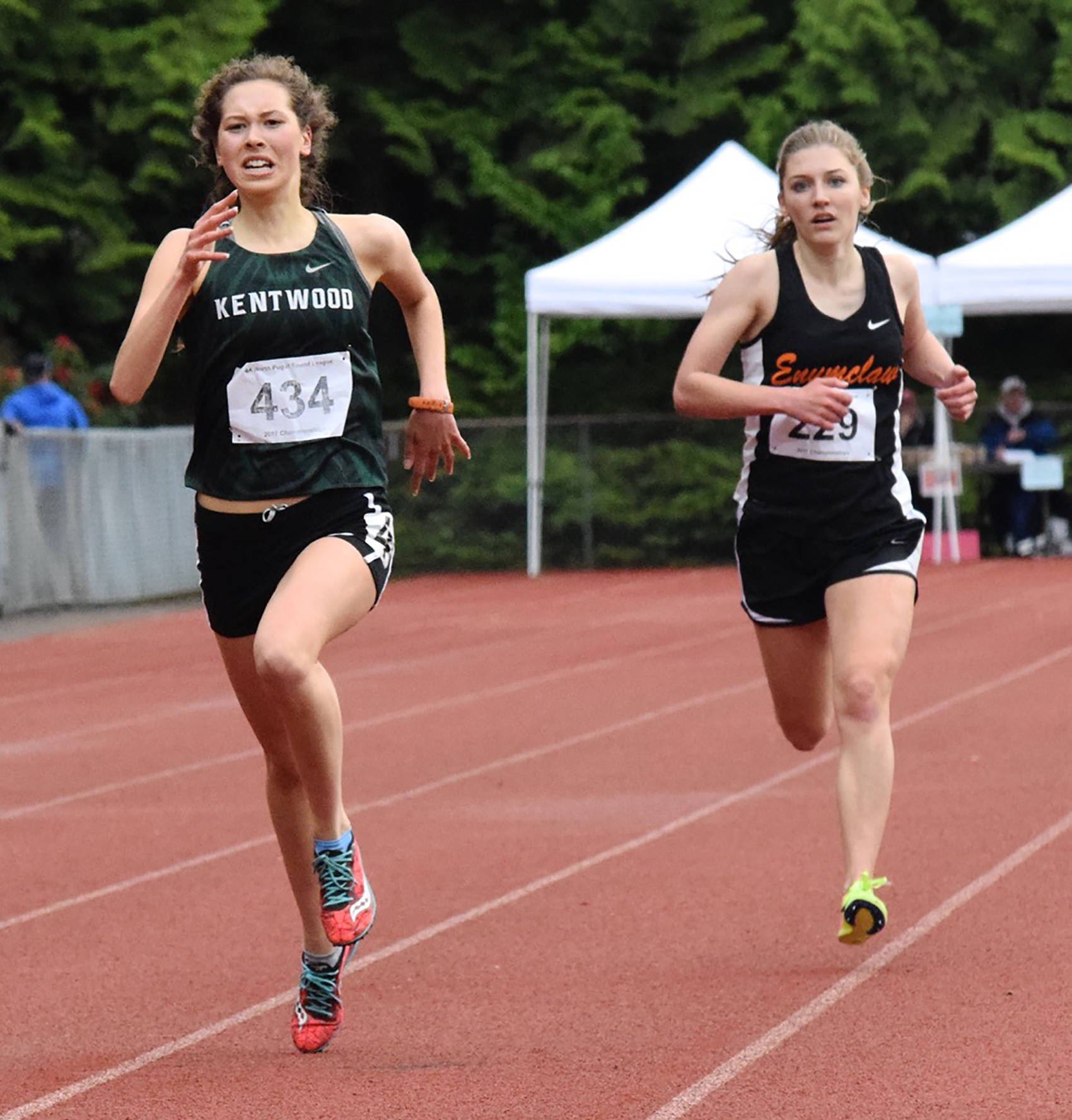 Kentwood’s Nicole Soleim dashes to victory in the 3,200 meters in 11:14.63, a personal best. Enumclaw’s Hunter Storm finished second. RACHEL CIAMPI, Kent Reporter