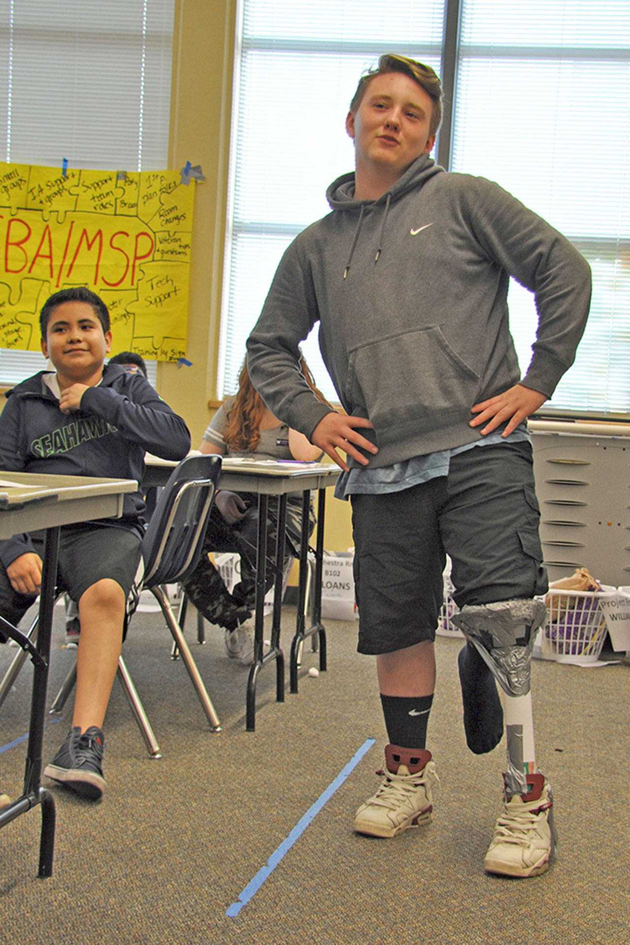 Mill Creek student Kenneth Roberts shows off the prosthetic leg his group made. Robert acted as the amputee for the project. HEIDI SANDERS, Kent Reporter