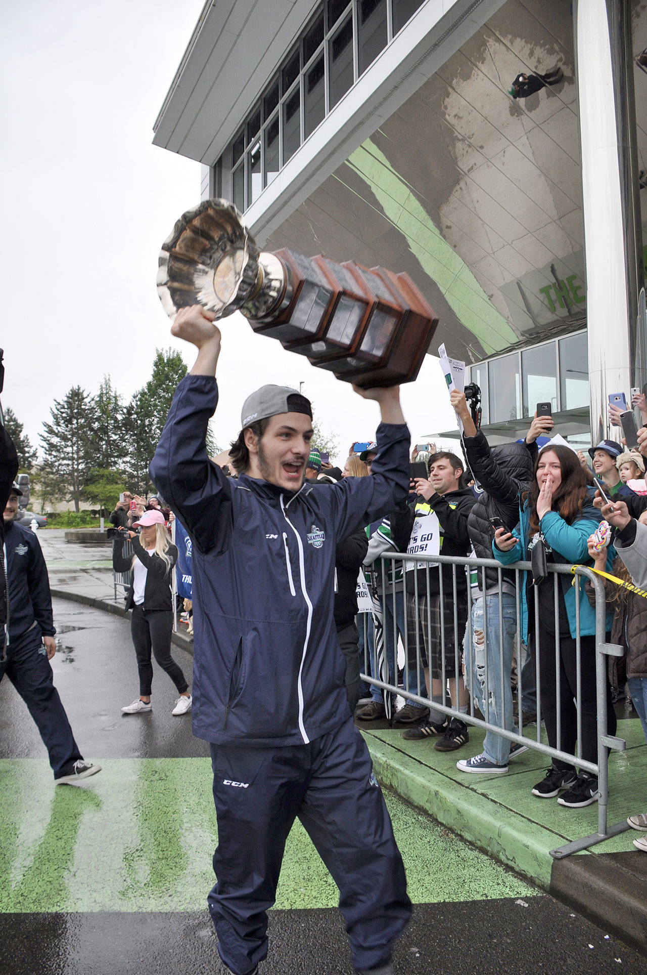 Thunderbirds co-captain Mathew Barzal hoists the Ed Chynoweth Cup in front of hundreds of T-Birds fans who welcomed the coaches and players home to the ShoWare Center on Monday – a day after the team clinched the Western Hockey League title with an overtime Game 6 victory against the Regina Pats in Saskatchewan. HEIDI SANDERS, Kent Reporter