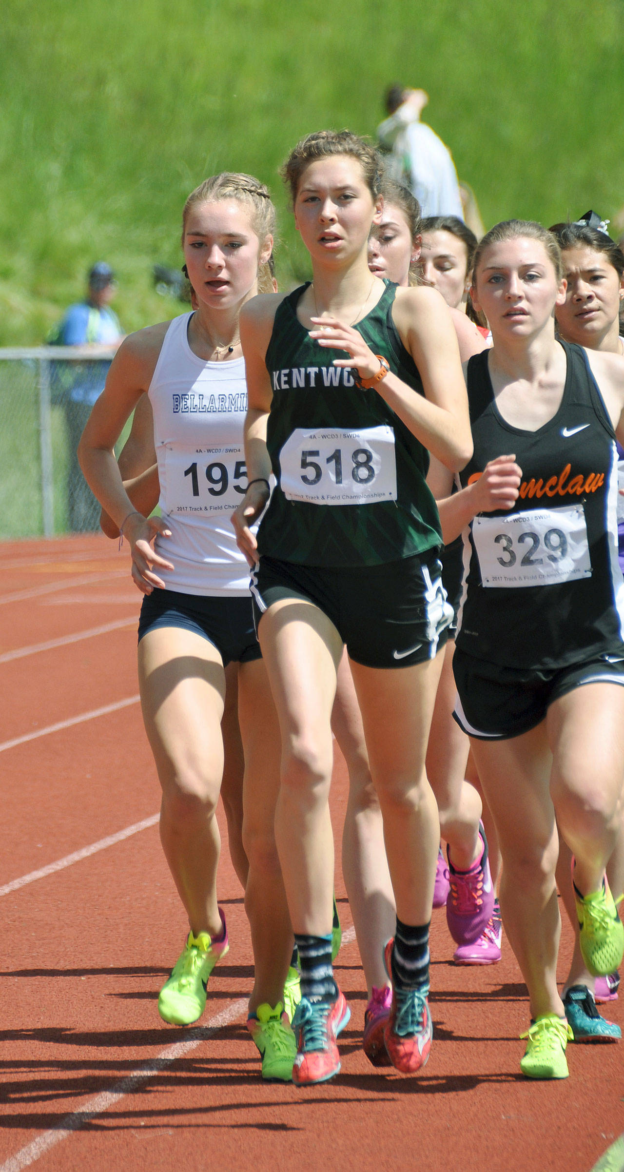 Kentwood’s Nicole Soleim runs to a third-place finish in the 3,200 meters last Saturday in the West Central District meet at French Field. HEIDI SANDERS, Kent Reporter