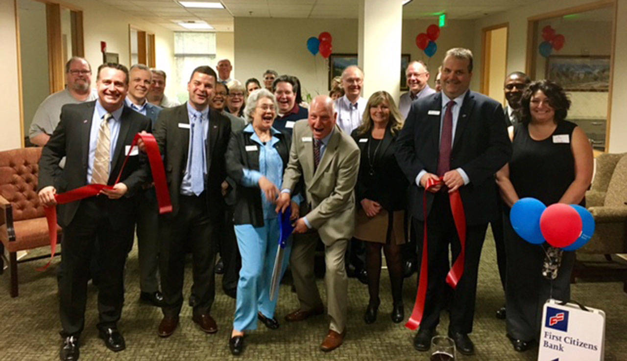 Mayor Suzette Cooke joins First Citizens Bank staff, colleagues and Chamber representatives for a ribbon-cutting ceremony at its new office in Kent on Thursday. COURTESY PHOTO