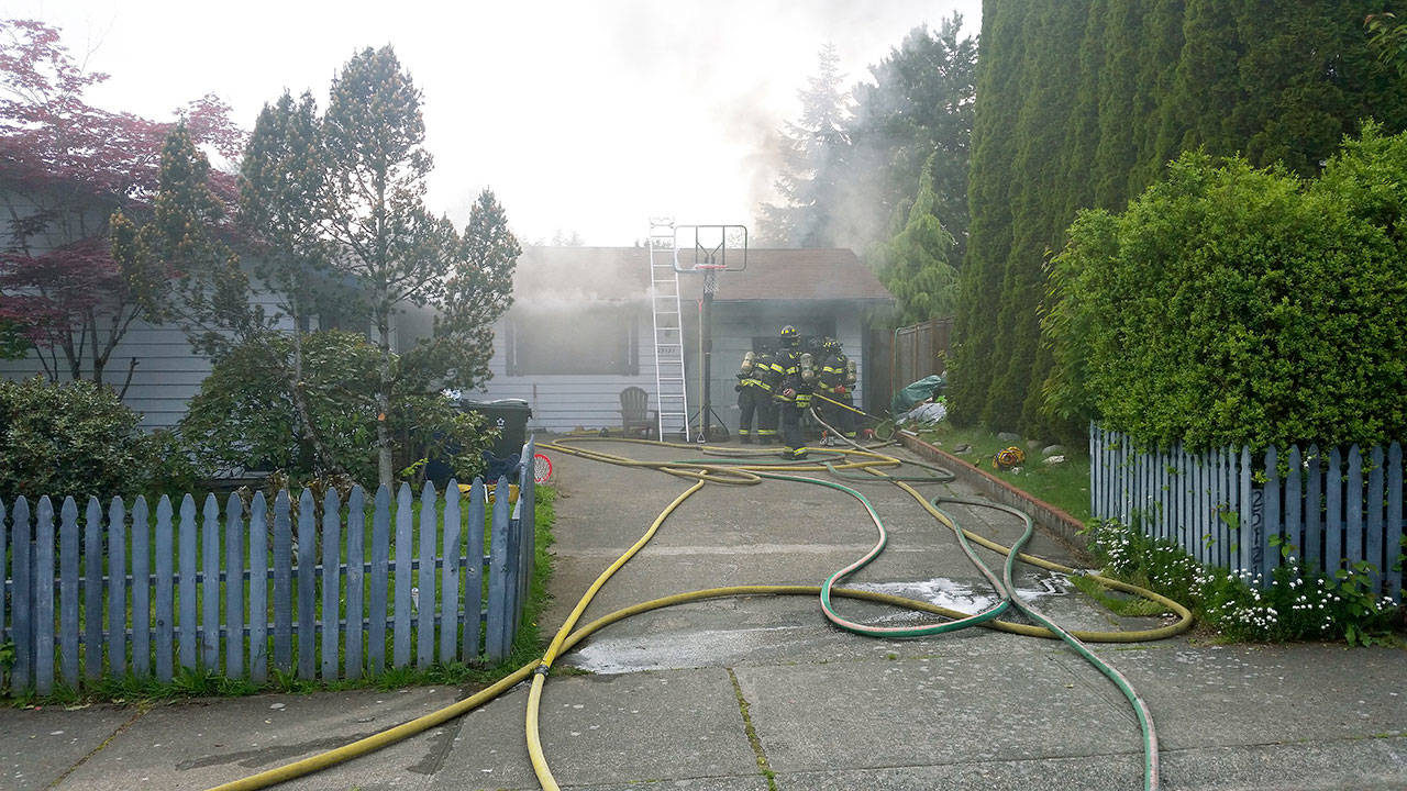 Firefighters put out a fire in a converted garage that damaged an East Hill home on Thursday. COURTESY PHOTO, Puget Sound Regional Fire Authority
