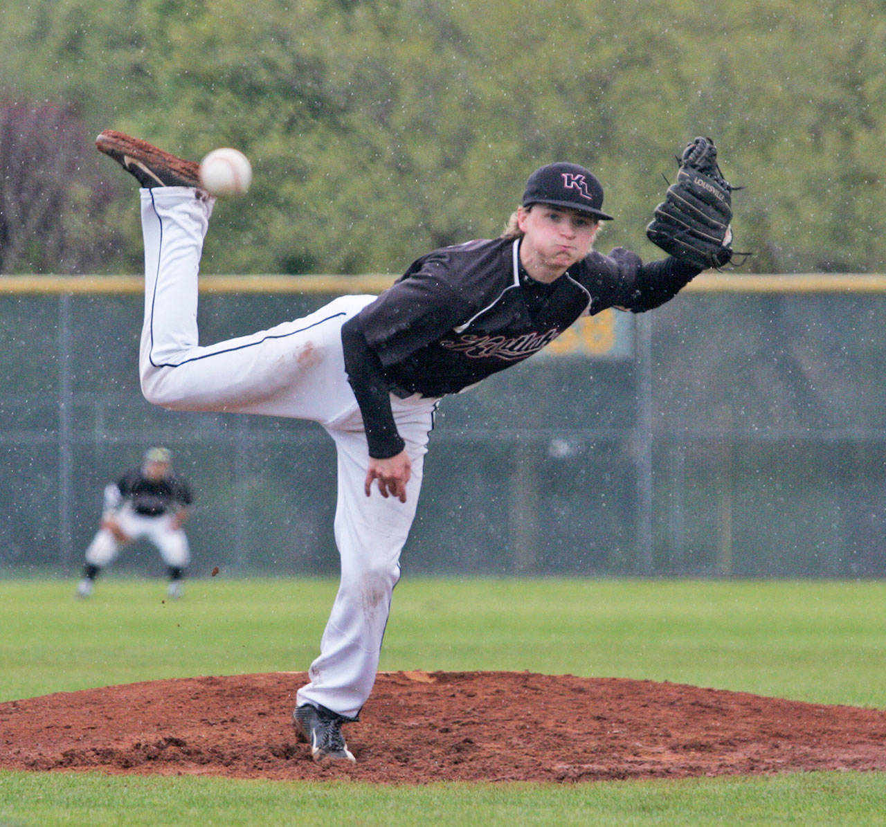 Kentlake’s Jordan Wright fires a pitch during district play. DENNIS BOX, Reporter