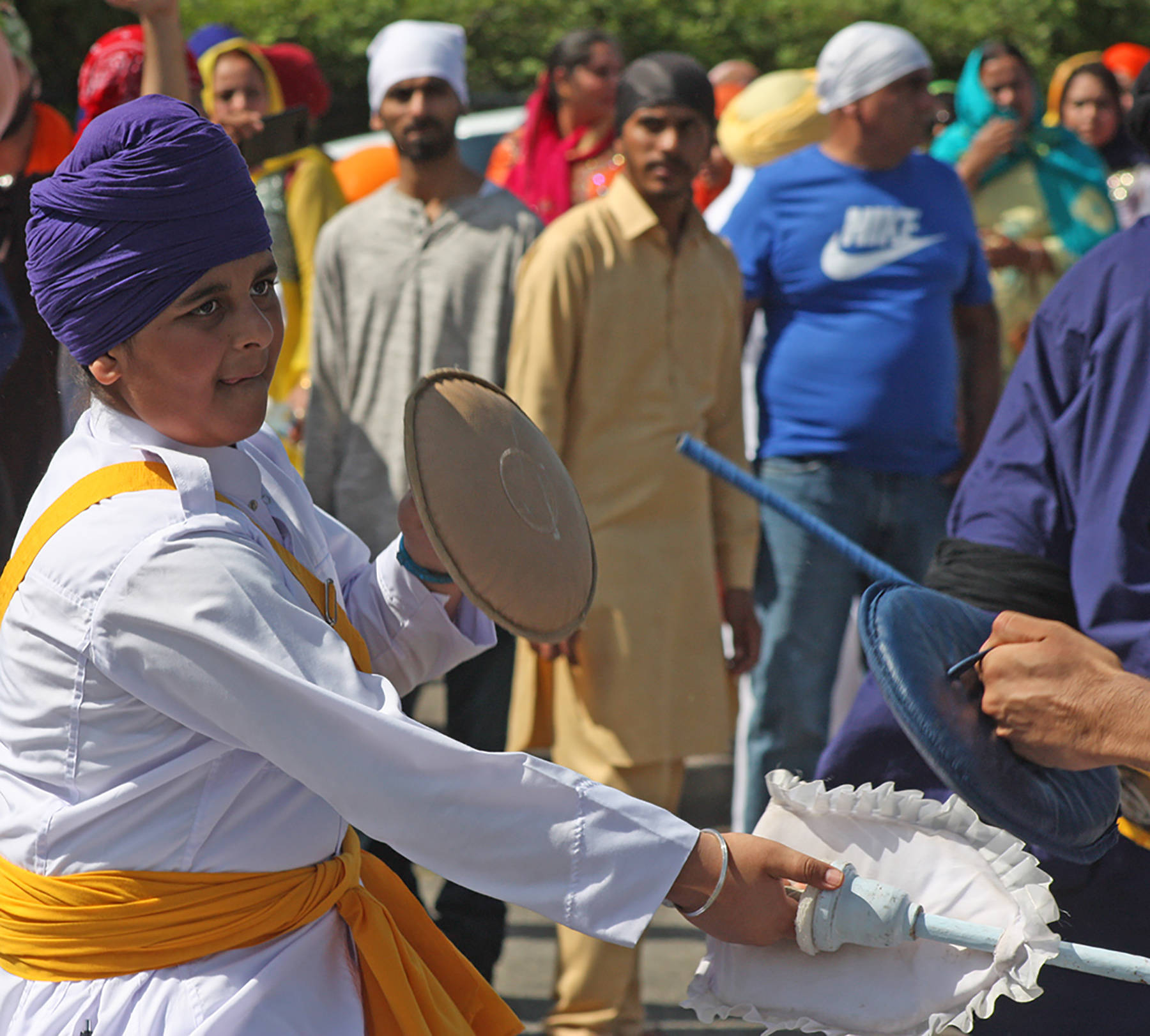 Combatants spar in a demonstration during the Khalsa Day parade through the streets of Kent on Sunday. MARK KLAAS, Kent Reporter