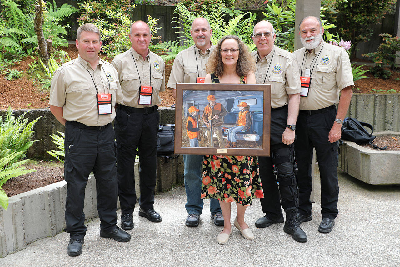 Cathy Lynch, an employee in the Kent School District’s transportation department, recently received the Washington Department of Fish and Wildlife’s Terry Hoffer award. She is joined by Washington Department of Fish and Wildlife (WDFW) hunter education and volunteer coordinator staff. From left, are Aaron Garcia, Mike Whorton, division manager Dave Whipple, Lynch, Lynch’s coordinator Steven Dazey and Chuck Ray. COURTESY PHOTO, WDFW