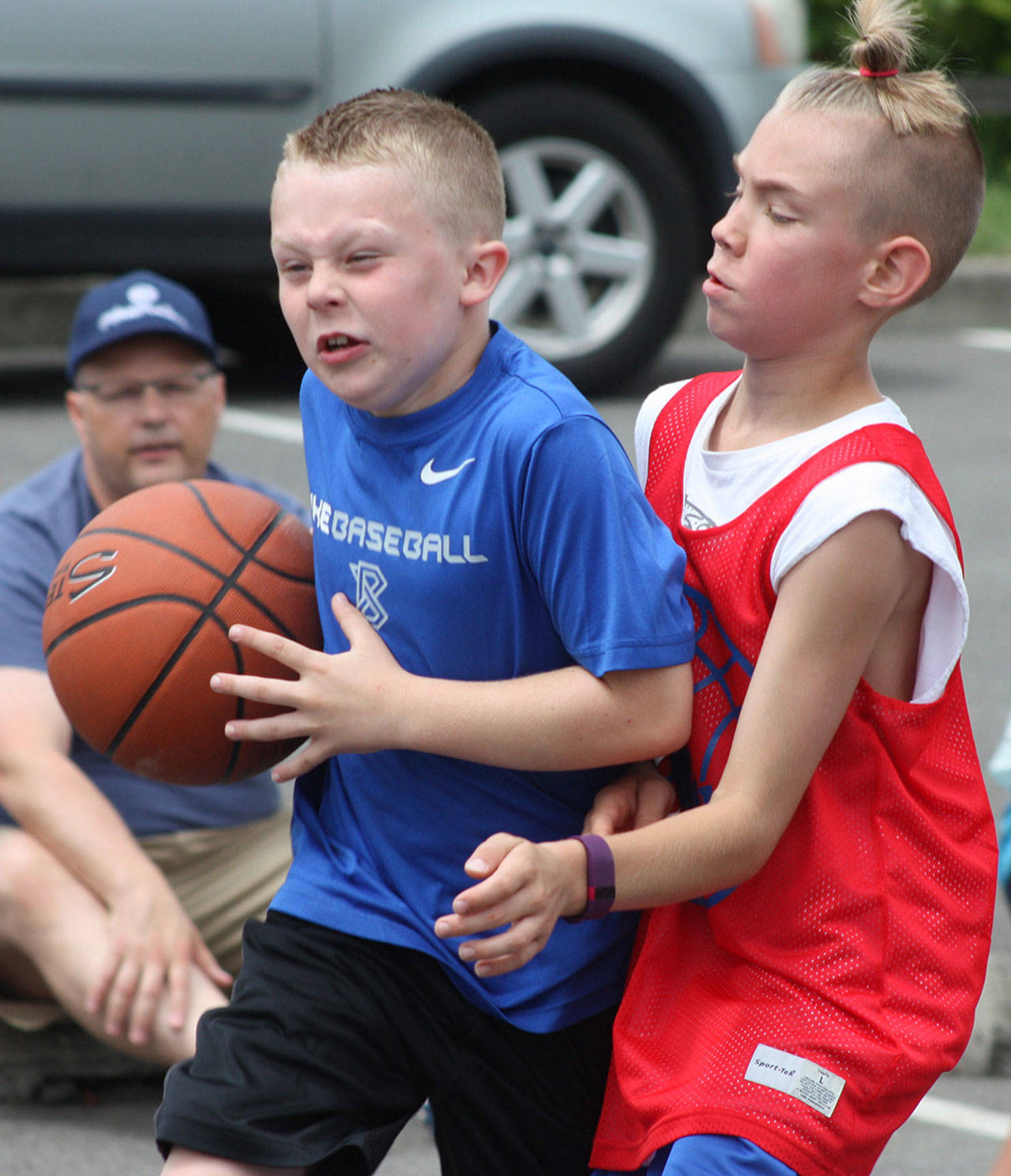 Jackson Whitaker of Liberty Blue drives on Grayson Frederick of the 26ers during fourth-grade boys division play during last year&rsquo;s ShoWare Shootout. MARK KLAAS, Kent Reporter
