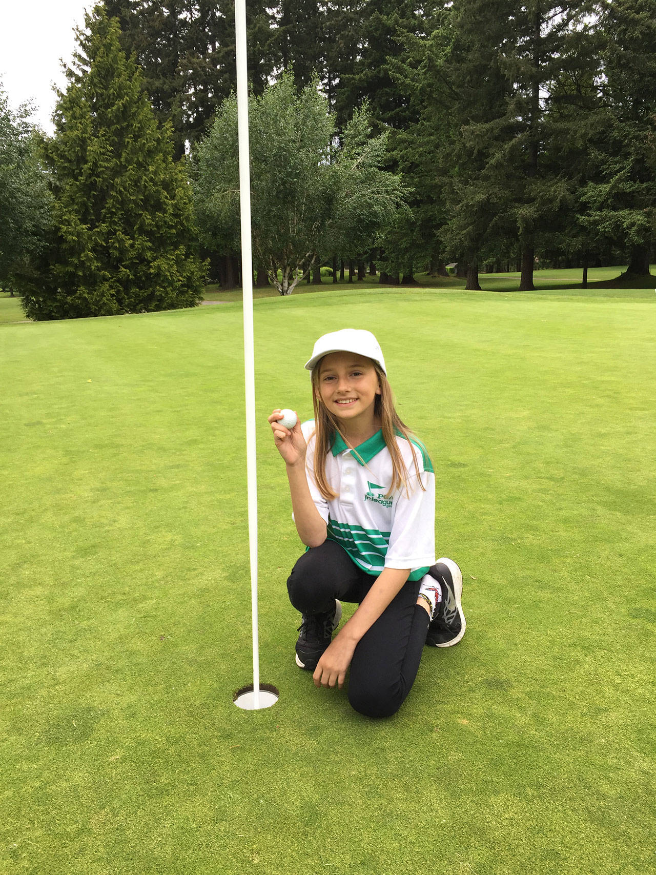 Kent’s Maya Hanson hit a hole-in-one in her first ever round of golf during recent league play at Meridian Valley. COURTESY