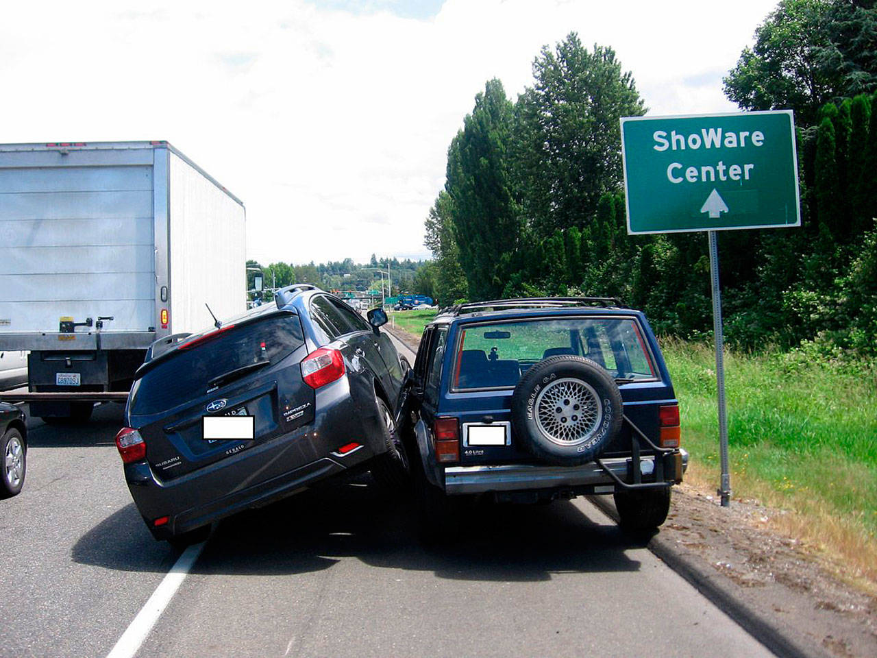 A driver of a Subaru moved over to the shoulder to block the path of a Jeep passing traffic on the shoulder Tuesday along State Route 516 in Kent. Courtesy Photo/State Patrol