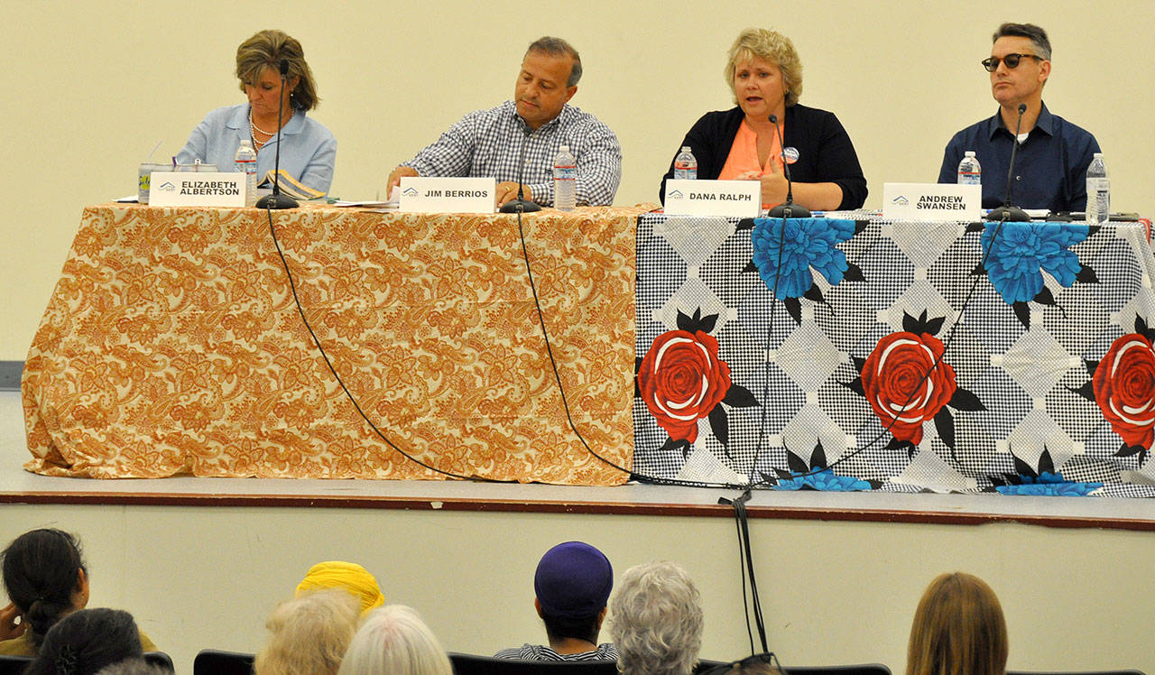 Kent mayoral candidates Elizabeth Albertson, Jim Berrios, Dana Ralph and Andrew Swansen at a Tuesday night forum at Kent-Meridian High School. The two candidates with the most votes in the Aug. 1 primary advance to the Nov. 7 general election. Heidi Sanders/Kent Reporter