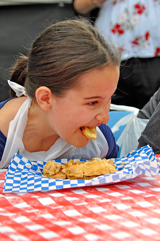 A girl competes in the pie-eating contest in 2016 at Kent’s Fourth of July Splash at Lake Meridian Park. File Photo