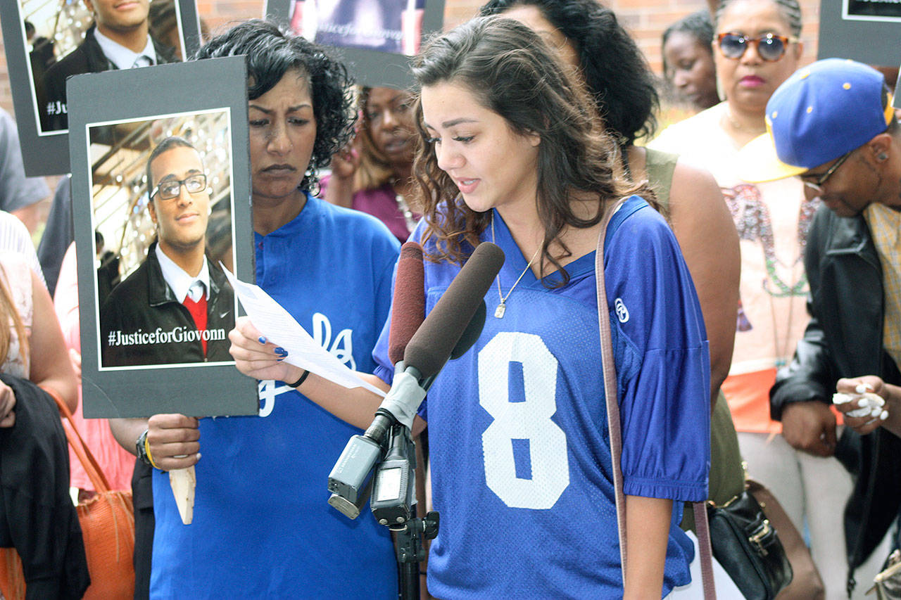 Savannah Gilley, 20, who had dated Giovonn Joseph-McDade, read a long list of demands last week outside the Kent Police Station that family and friends want from police. On Tuesday, police released the names of the officers, documents and videos from the officer-involved shooting of Joseph-McDade last month. Steve Hunter/Kent Reporter