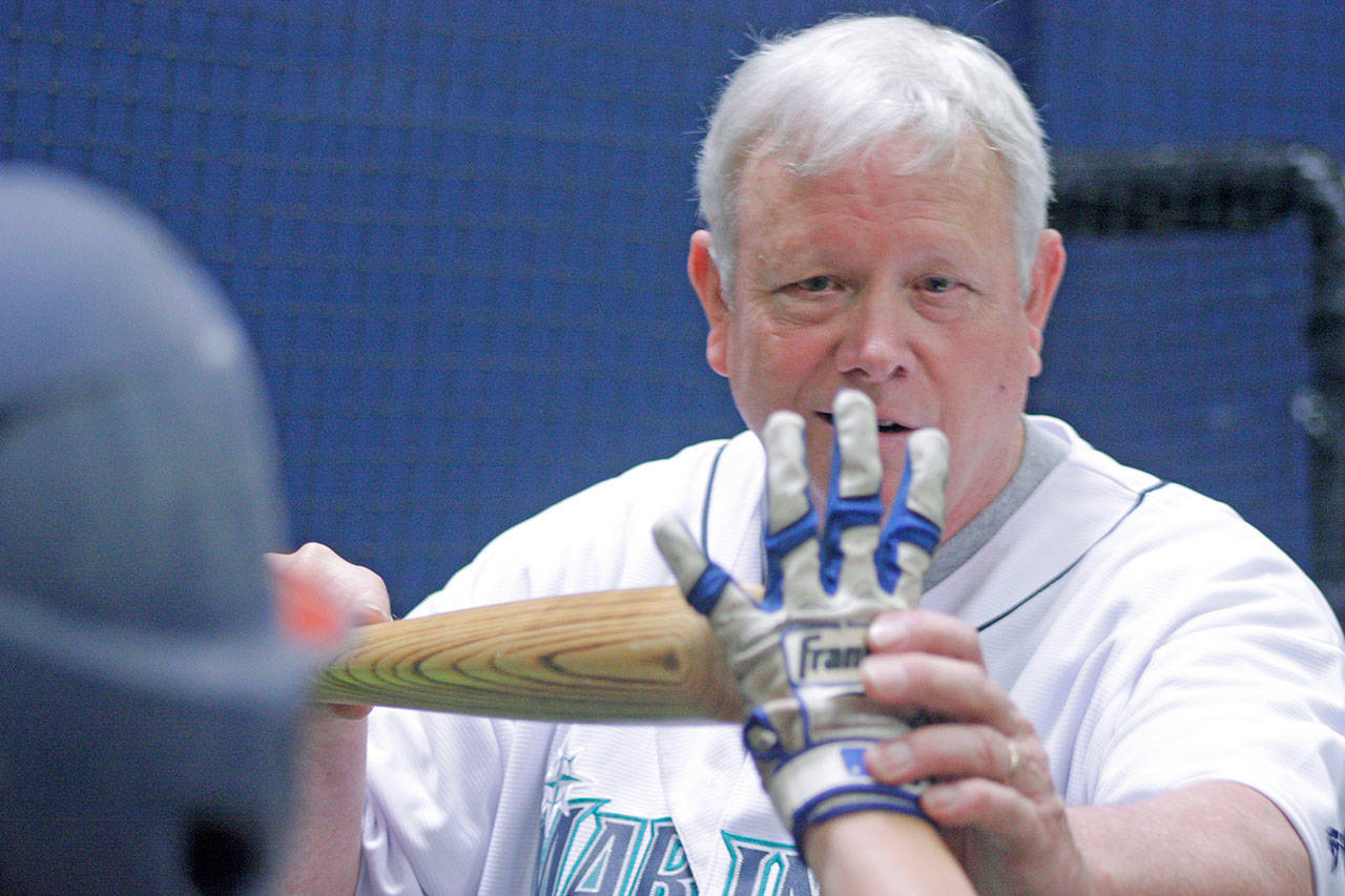 Former major-leaguer Barry Bonnell teaches the young players how to grip the bat when bunting. MARK KLAAS, Kent Reporter