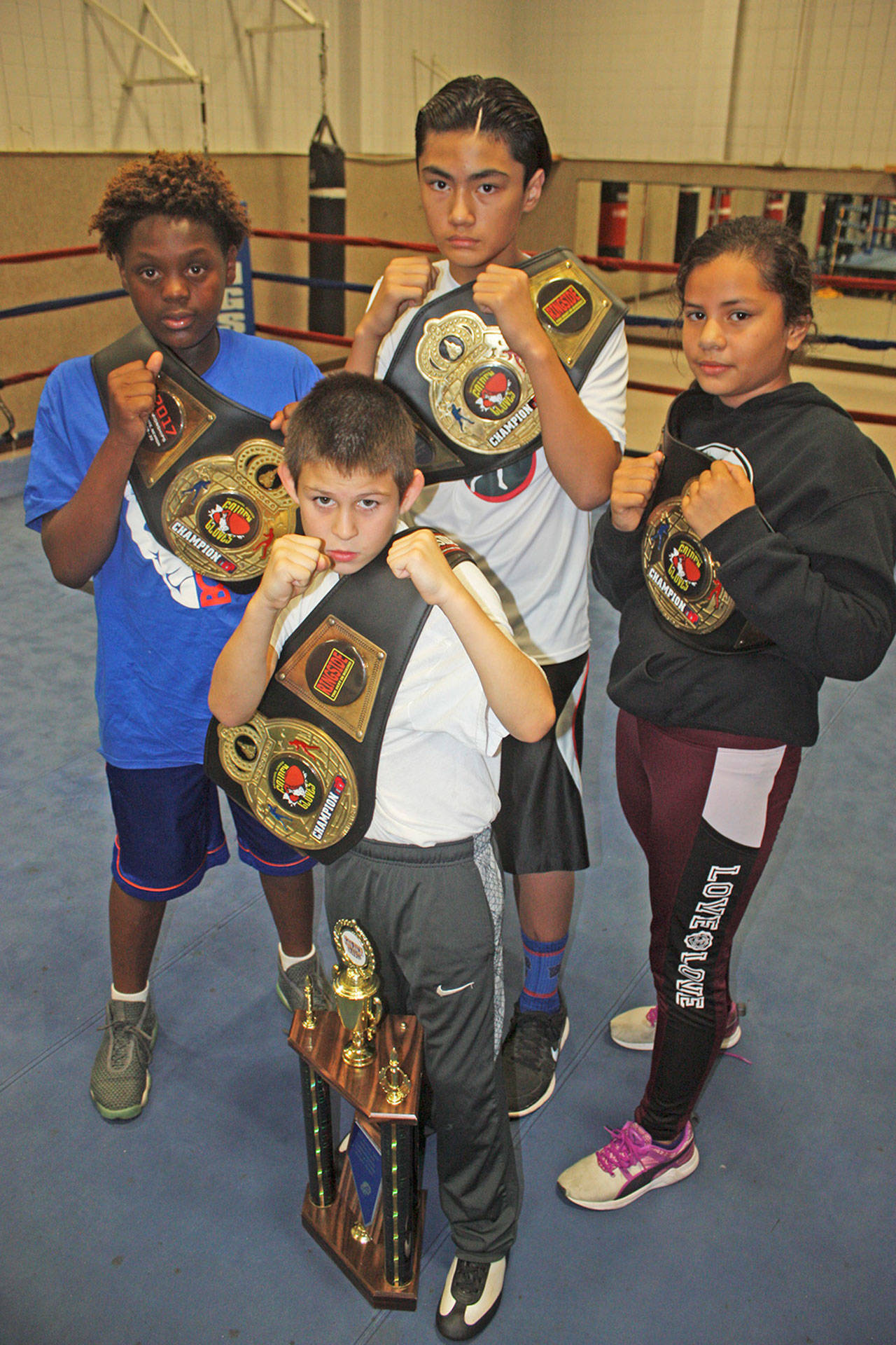 Nathan Kim, middle, was one of four Tacoma Boxing Club national champions for the Tacoma Boxing Club. Others included, from left, 12-year-old Malachi Jenkins (125 pounds), 9-year-old Joseph Nieto (65 pounds, most outstanding boxer in his division) and 10-year-old America Hernandez (125 pounds, female division). MARK KLAAS, Kent Reporter