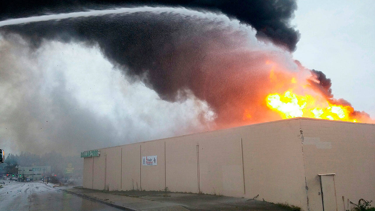 Flames shoot from the Dollar Tree store on Kent’s West Hill during a Nov. 13 fire. Courtesy Photo/Puget Sound Fire