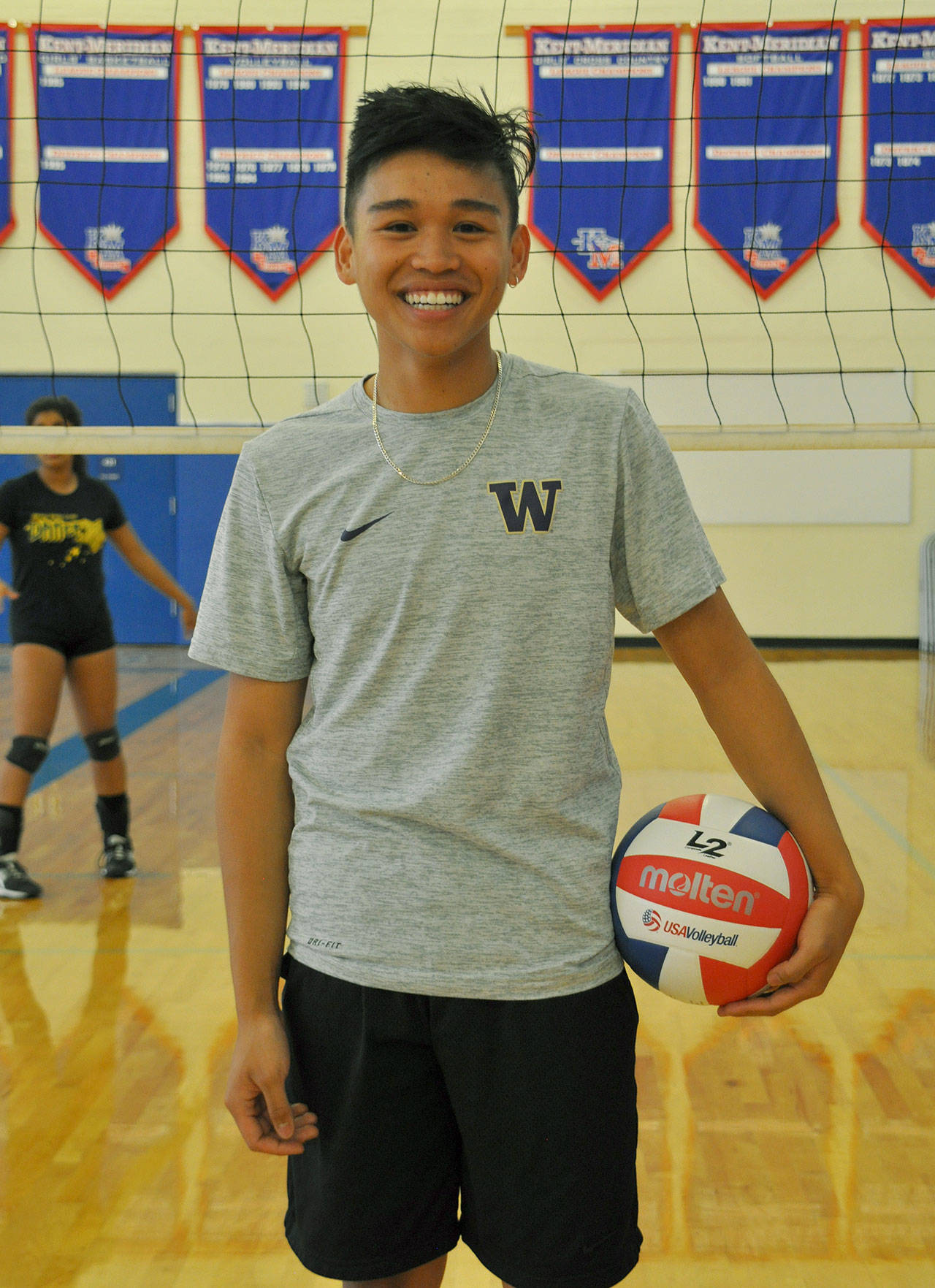 Jared Caberto is small in stature but big on his drive to play and learn more about volleyball. The manager of the Kent-Meridian team, who practices with the girls, would like to coach the sport one day. HEIDI SANDERS, Kent Reporter