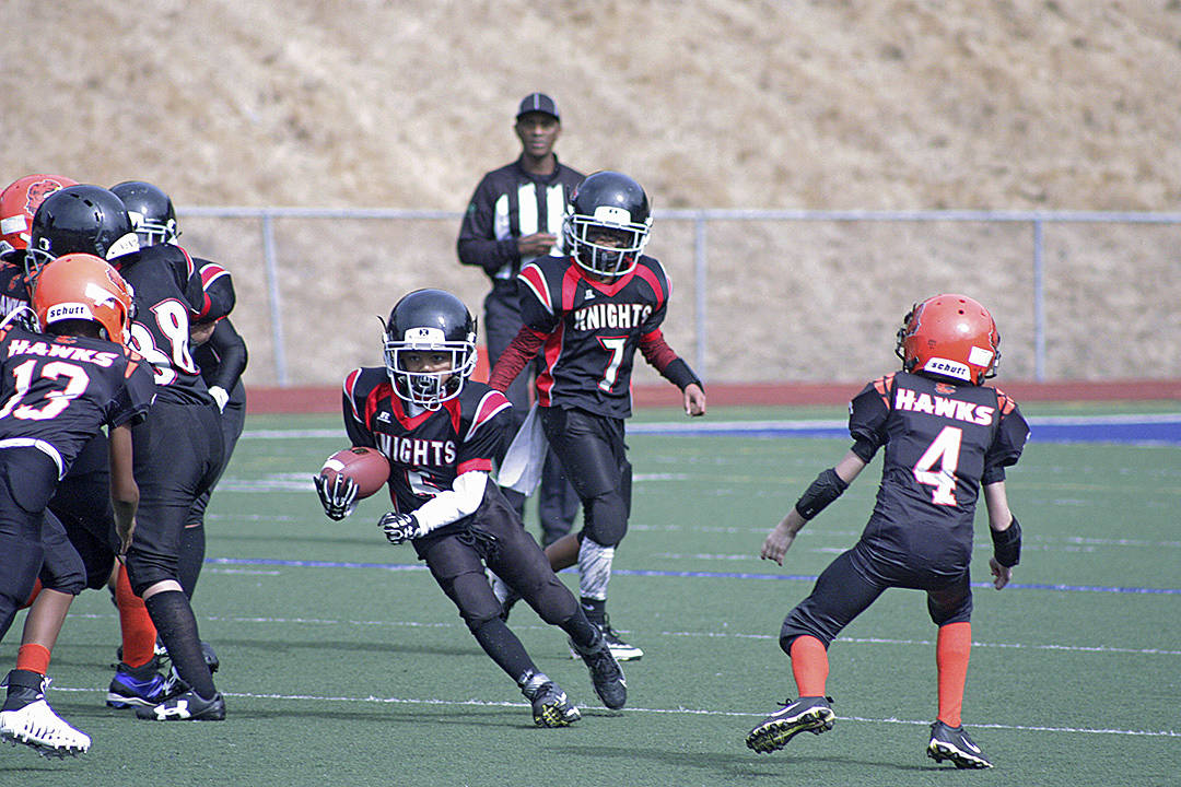 The Knights’ Tavion Trotter (5) looks to break into the clear against the Hawks’ defense. MARK KLAAS, Kent Reporter