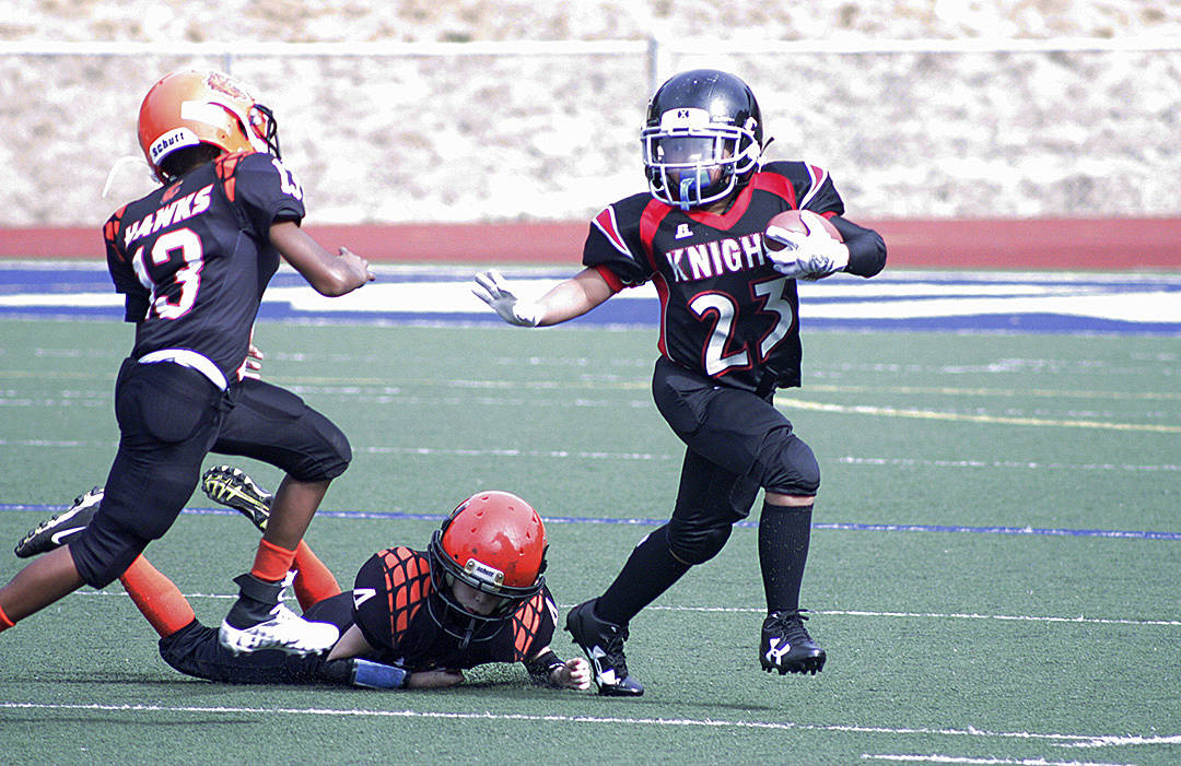 The Knights’ Noah Castro tries to break outside for a big gain. MARK KLAAS, Kent Reporter