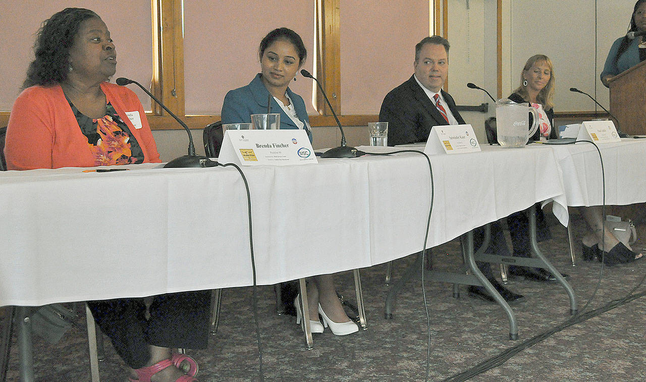 Participants in the Kent City Council candidate forum included from left to right, Brenda Fincher, Satwinder Kaur, Paul Addis and Toni Troutner. HEIDI SANDERS/Kent Reporter