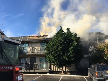 Firefighters contain and douse a SeaTac apartment fire Friday. COURTESY PHOTO, Puget Sound Regional Fire Authority