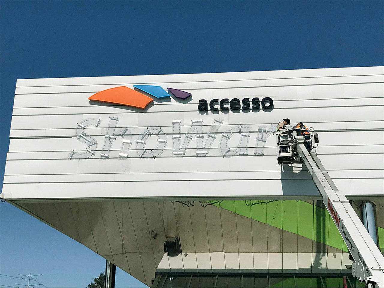 Crews place the new accesso ShoWare Center name last week on the city-owned arena. COURTESY PHOTO, accesso ShoWare Center
