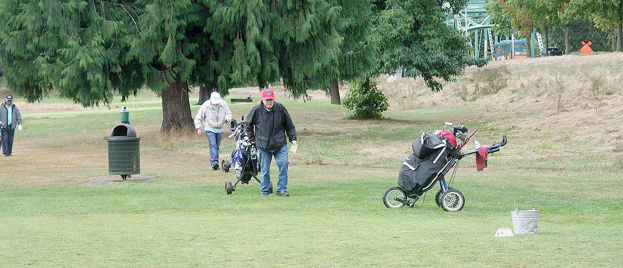 Golfers from the Riverbend par 3 senior league play one of the final rounds at the course. The city of Kent sold the property to a developer who will replace the course with 500 apartments. STEVE HUNTER/Kent Reporter